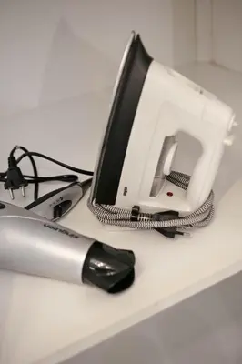 a sewing machine sitting on a counter with a pen at Trevi Fountain Apartment in Rome