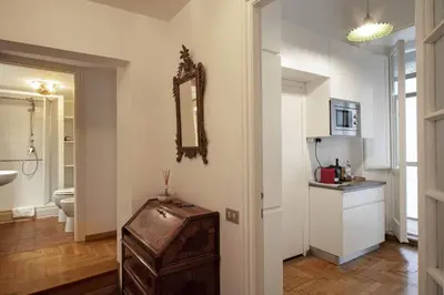 a bathroom with a sink and a mirror on the wall at Trevi Fountain Apartment in Rome
