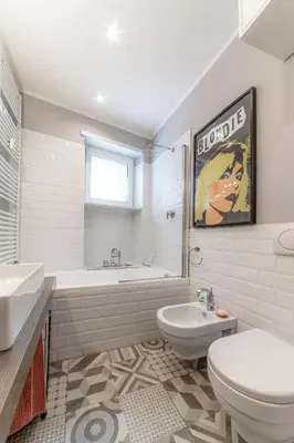 a bathroom with a tub and a toilet and a sink at Casa Gioia - Metro Garbatella in Rome