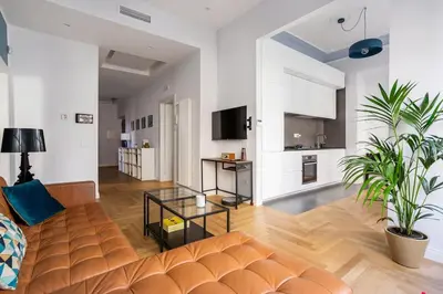 a living room with a couch and a table at La finestra verde in Rome