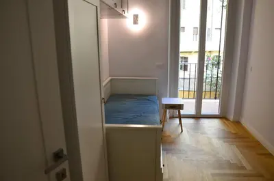 a room with a bed in a room with a window at La finestra verde in Rome