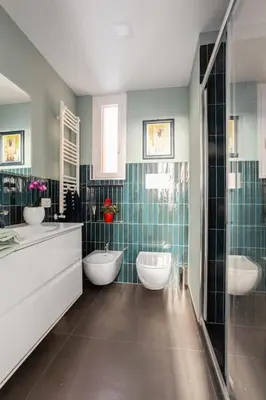 a bathroom with two sinks and two toilets at La finestra verde in Rome
