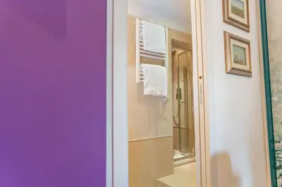 a bathroom with a sink and a mirror at PgrHome Colosseo 11 in Rome