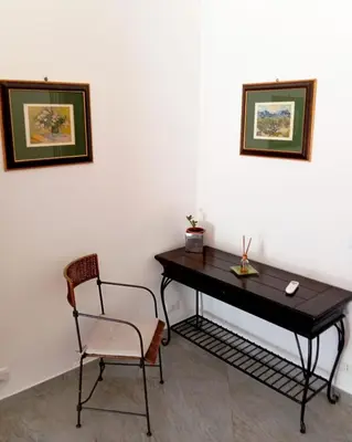 a desk and a chair in a room at casaLucina in Rome