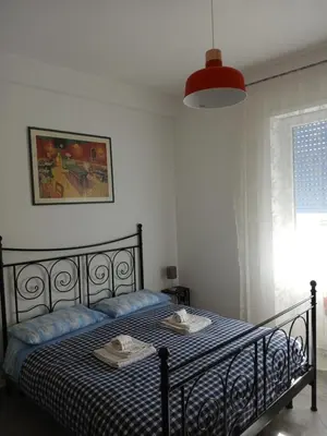 a bedroom with a bed with two towels on it at casaLucina in Rome