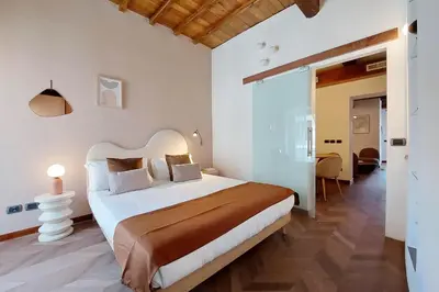 a bedroom with a large bed in a room at YCH Elegant flat with terrace to Trastevere in Rome