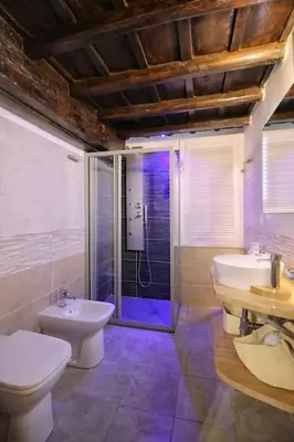 a bathroom with a toilet and a sink and a shower at Hidden Treasure-Campo de' Fiori in Rome