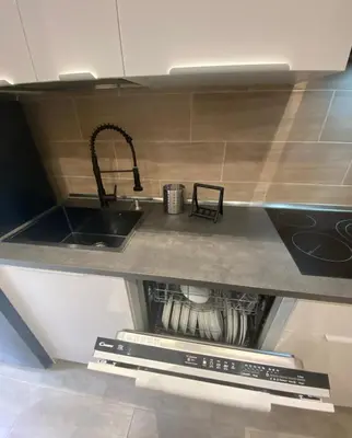 a kitchen with a sink and a counter top at La Casa di Marco Polo in Rome