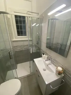 a bathroom with a shower and a sink and a toilet at La Casa di Marco Polo in Rome