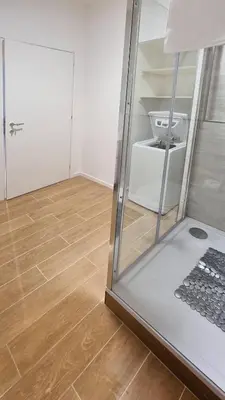 a laptop computer sitting on the floor in a room at Vignola New Apartment in Rome