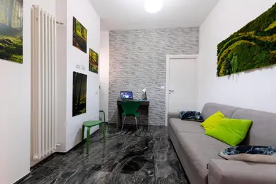 a living room with a couch and a table at Home Big Crirè at 724 in Rome