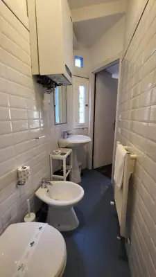 a bathroom with two sinks and two toilets at Vivaldi in Rome