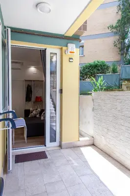 an open door of a house with a bedroom at Garden City House Roma - Casa con giardino privato in Rome
