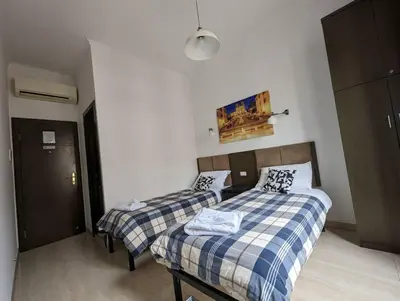 two beds in a small room with at Francesco Romestay - Termini in Rome