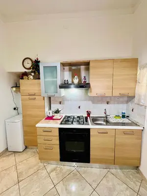 a kitchen with a sink and a stove top oven at Monolocale San Giovanni in Rome