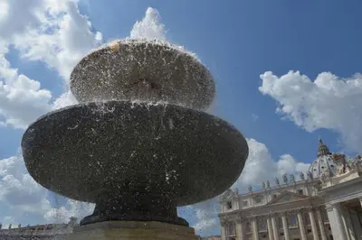 a water fountain in front of a building at Air Vatican in Rome