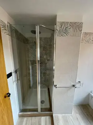 a shower with a glass door in a bathroom at 
