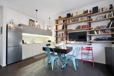 a kitchen with a table and chairs and a refrigerator at 15 MIN FROM THE VATICAN Wi-fi and garden in Rome