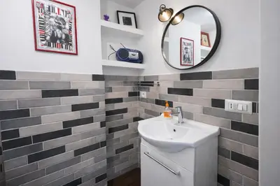 a bathroom with a sink and a mirror at 15 MIN FROM THE VATICAN Wi-fi and garden in Rome