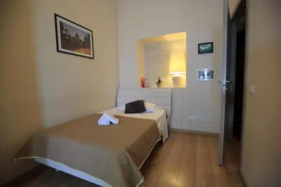 a small bedroom with two beds in a room at Aria Rome Rooms in Rome