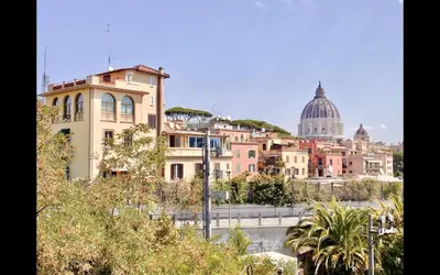 a view of a city with buildings and a dome at Charming mini apartment near Vatican with parking in Rome