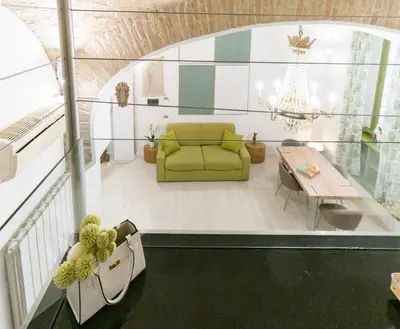 a dining room with a table and chairs and a window at LOFT49 in Rome