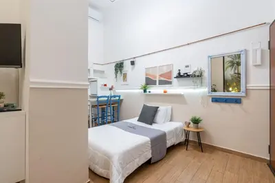 a small bedroom with a bed and a window at Rhome_Hub in Rome