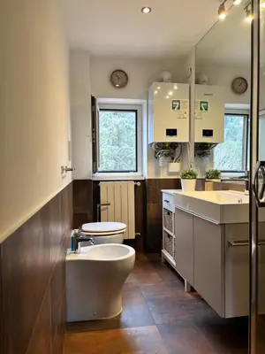 a bathroom with a toilet and a sink at Casa Vittoria Stadio olimpico con panorama in Rome