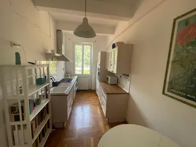 a kitchen with white cabinets and a sink at Casa Vittoria Stadio olimpico con panorama in Rome