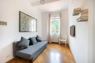 a living room with a couch and a tv at Casa Vittoria Stadio olimpico con panorama in Rome