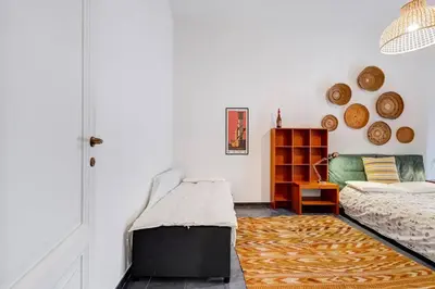 a living room with a bed and a couch at Termini Sweet Home in Rome