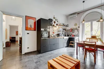 a kitchen with a table and a dining room at Termini Sweet Home in Rome