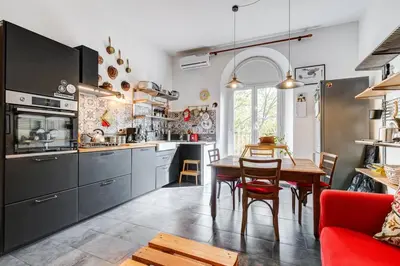 a kitchen with a table and a dining room at Termini Sweet Home in Rome
