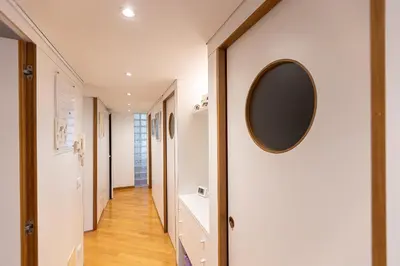 a hallway with a mirror on a wall at San Gioacchino View by Rental in Rome in Rome