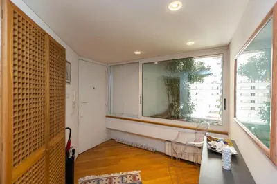 a room with a table and a large window at San Gioacchino View by Rental in Rome in Rome