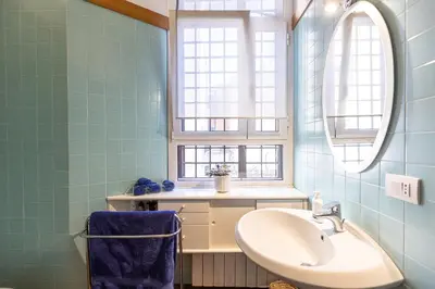 a bathroom with a sink and a window at San Gioacchino View by Rental in Rome in Rome
