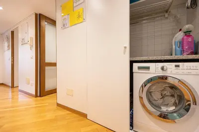 a washer and dryer in a laundry room at San Gioacchino View by Rental in Rome in Rome