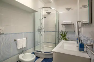 a bathroom with a shower and a sink and a toilet at Daplace - Arianna Apartment in Rome