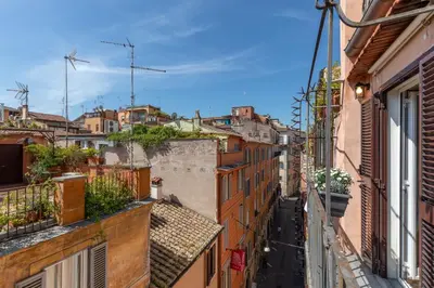 an alley in an old town with buildings at Daplace - Arianna Apartment in Rome