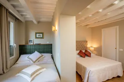 a bedroom with two beds and a window at Daplace - Arianna Apartment in Rome