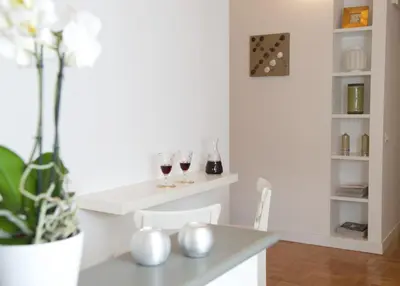 a dining room with two wine glasses on a table at Vatican Charme in Rome