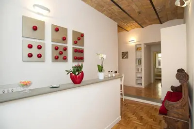 a room with a counter with apples on the wall at Vatican Charme in Rome