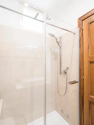 a shower with a glass door in a bathroom at Marisol's House, Colosseo in Rome
