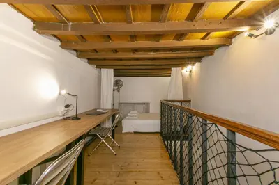 a hallway with a table and a desk in a room at Pantheon Palazzo Nari #9 in Rome