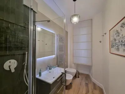 a bathroom with a sink and a toilet and a shower at A casa di Marisa in Rome