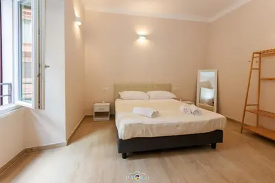 a bedroom with a bed with two towels on it at Domus Degli Dei in Rome