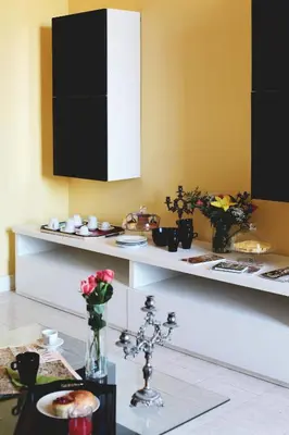 a kitchen with a counter with dishes on it at Bed and Breakfast Piazza Vittorio87 in Rome