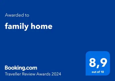 a blue house with the text awarded to family home at family home in Rome