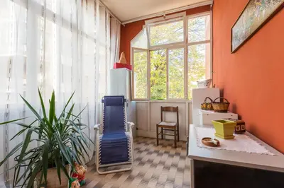 a play room with a blue slide and a plant at family home in Rome