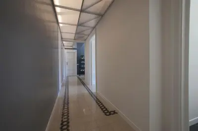 a corridor of a hallway with white walls and a ceiling at Saint Peter's Keys in Rome